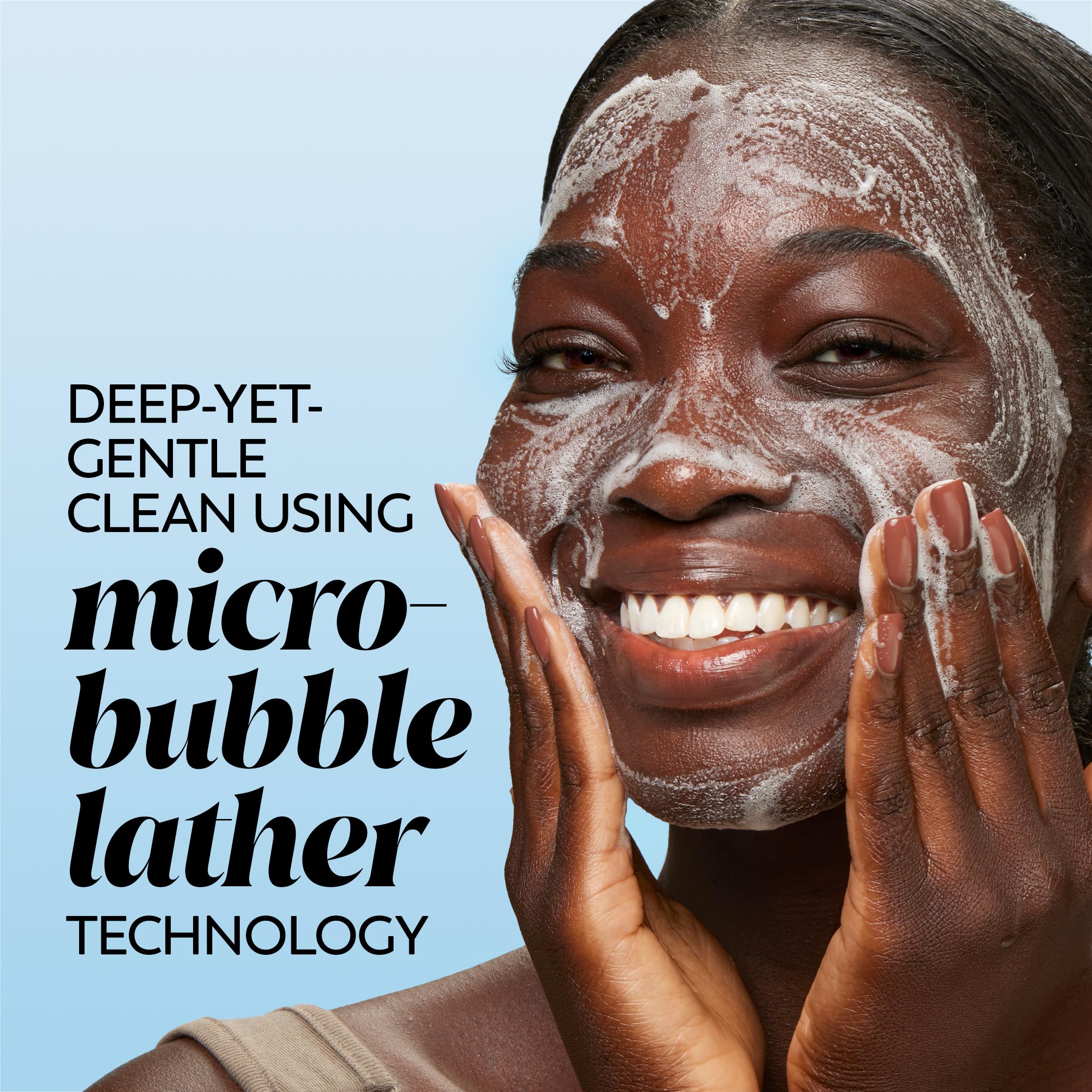 Olay water-activated dissolving facial cleanser pad dissolving in a wet palm