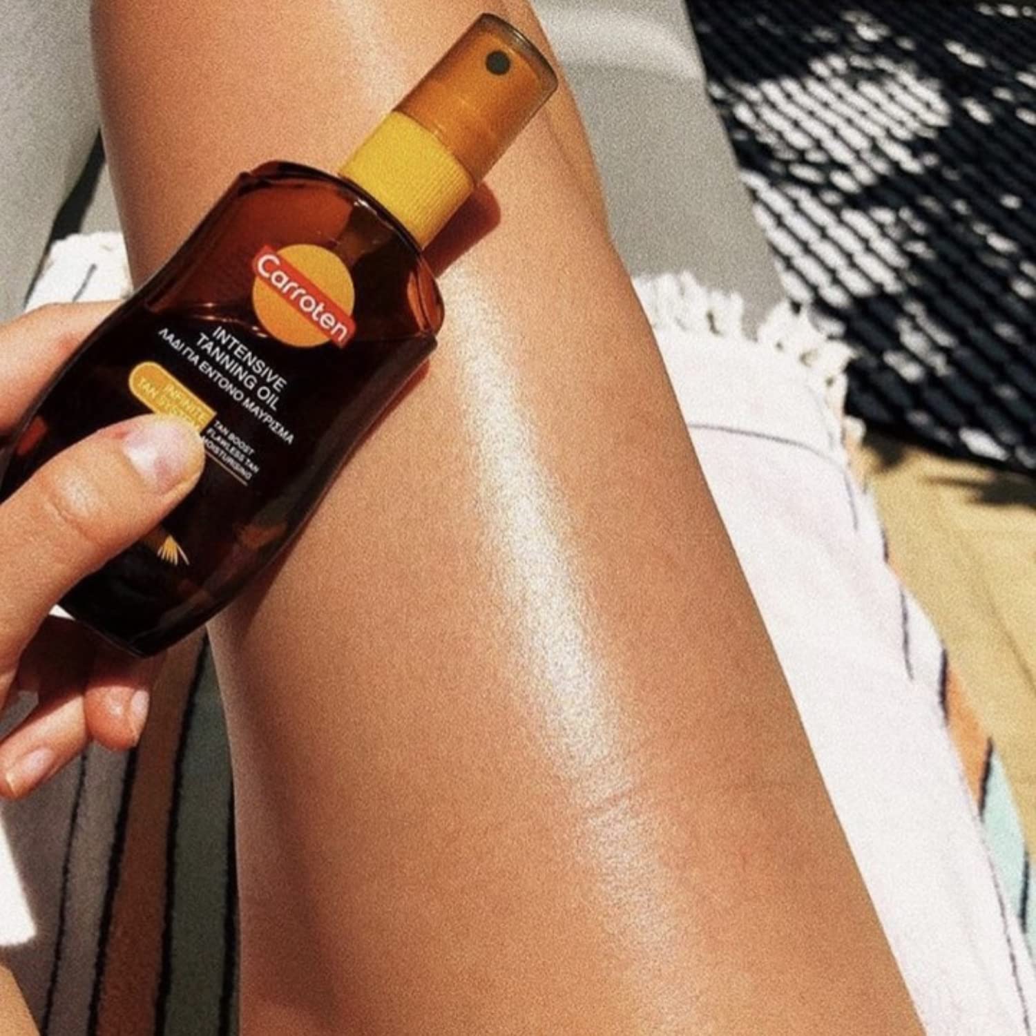 Close up of Carroten intensive tanning oil spray nozzle