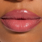 Close up swatch of Revolution Beauty London Pout Lip Gloss Stick in Sweet Rose shade