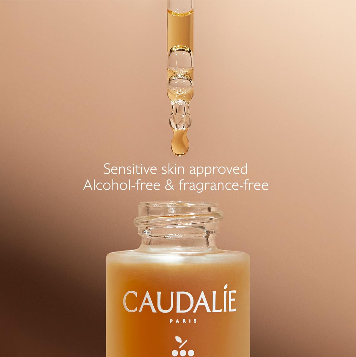 Lifestyle shot of Caudalie Self-Tan Sun Drops with moisturizer