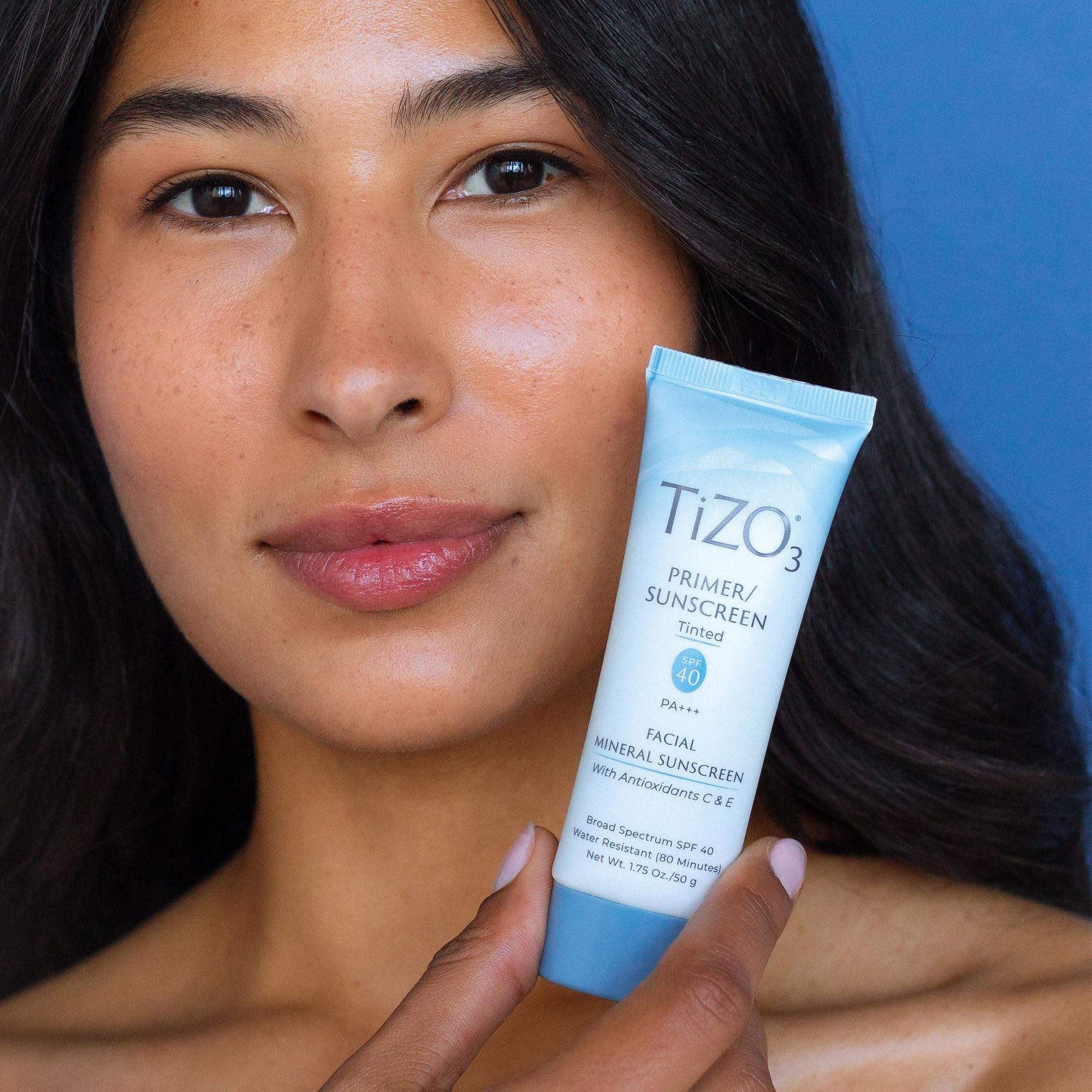 Close up of Tizo3 sunscreen bottle and ingredients