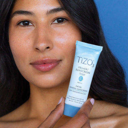 Close up of Tizo3 sunscreen bottle and ingredients