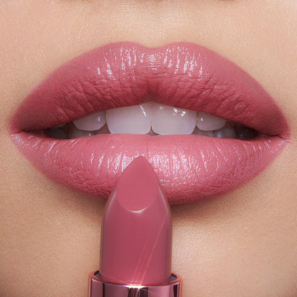 Charlotte Tilbury Icon Baby shimmering nude-rose moisturizing lipstick for full looking lips.