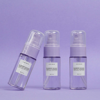 Side profile of Glow Recipe 30ml transparent bottle revealing the purple hued gel cleanser inside