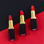 Lifestyle flat lay of evpct 3 pieces red velvet lipstick set