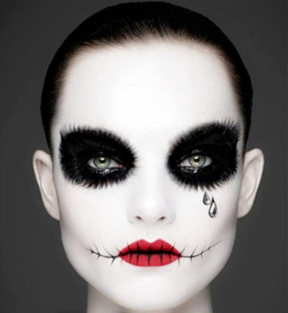Hypoallergenic vegan friendly white face paint stick positioned vertically for size view.