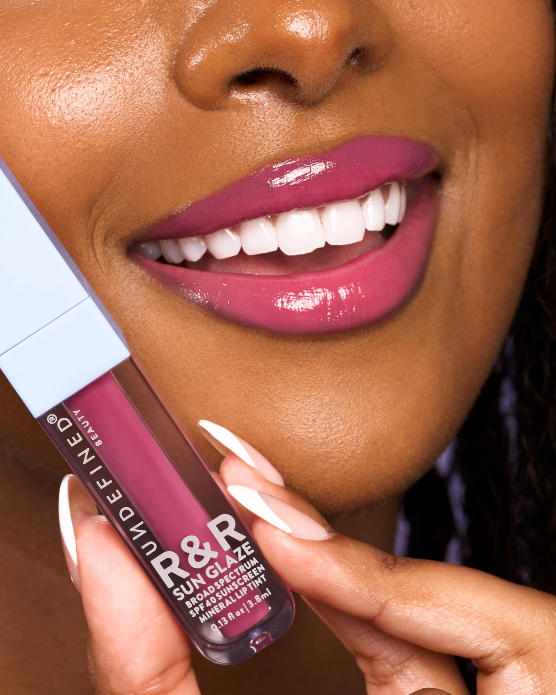 Side profile of Undefined R&R Sun Glaze Pink lip oil tube