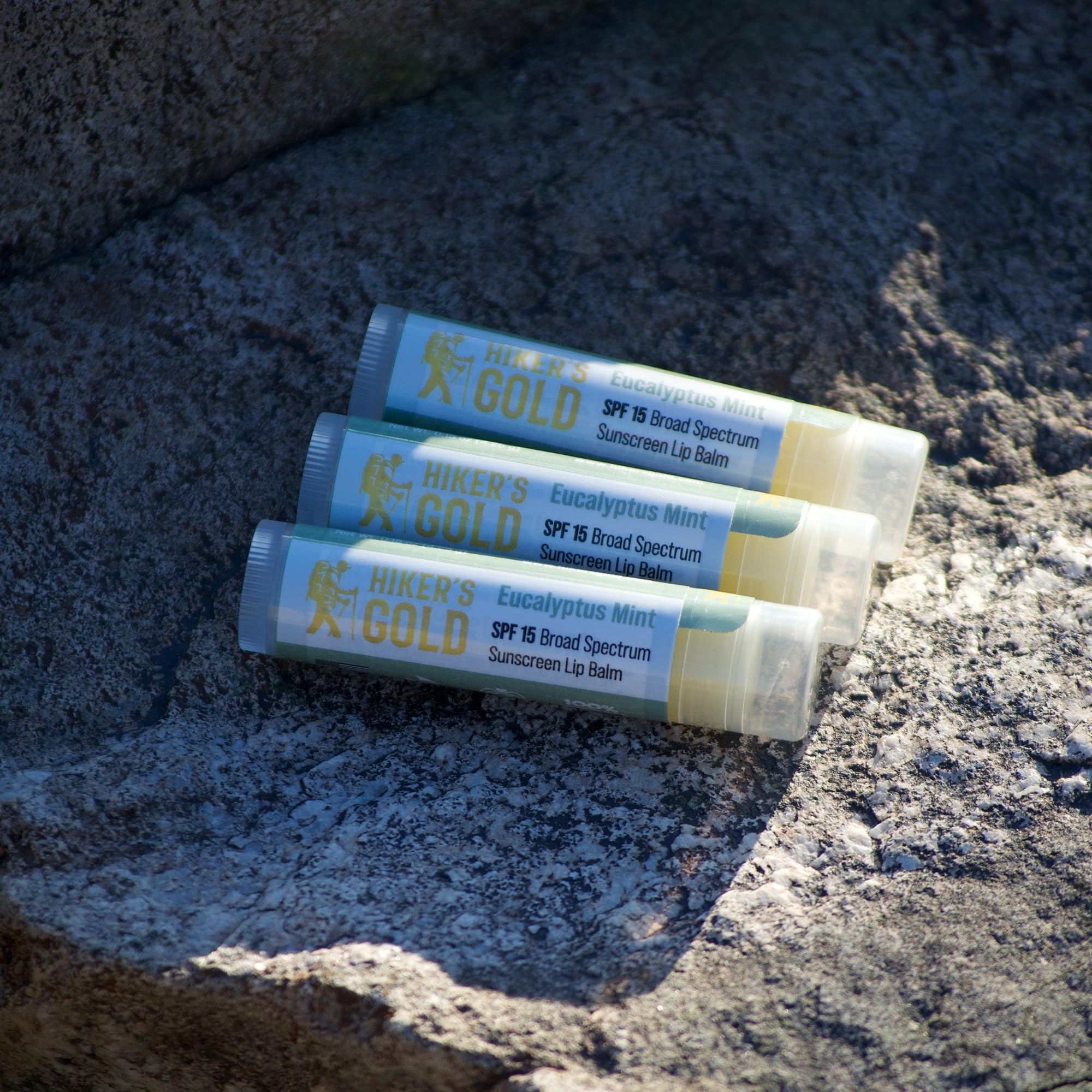 Close up of Hiker's Gold Eucalyptus Mint lip balm tubes