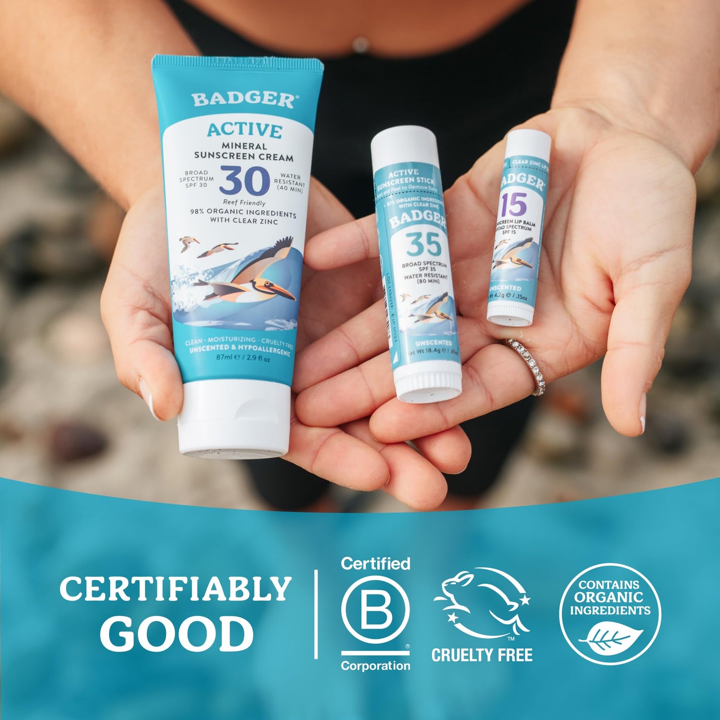 Badger zinc oxide sunscreen lip balm in hand for scale