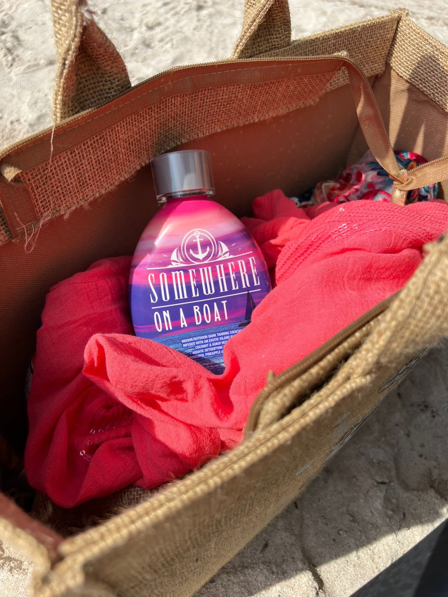 Close up of Dark Tans Exclusive white tanning lotion branding