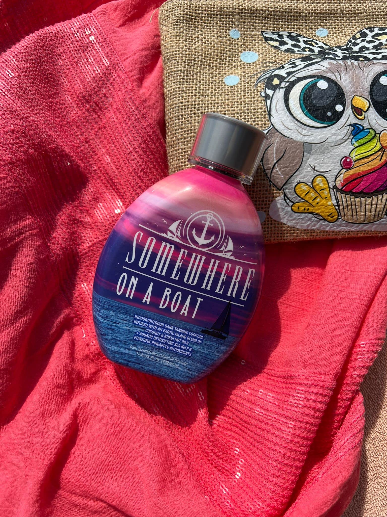 Somewhere On A Boat tanning lotion bottle against a clean background