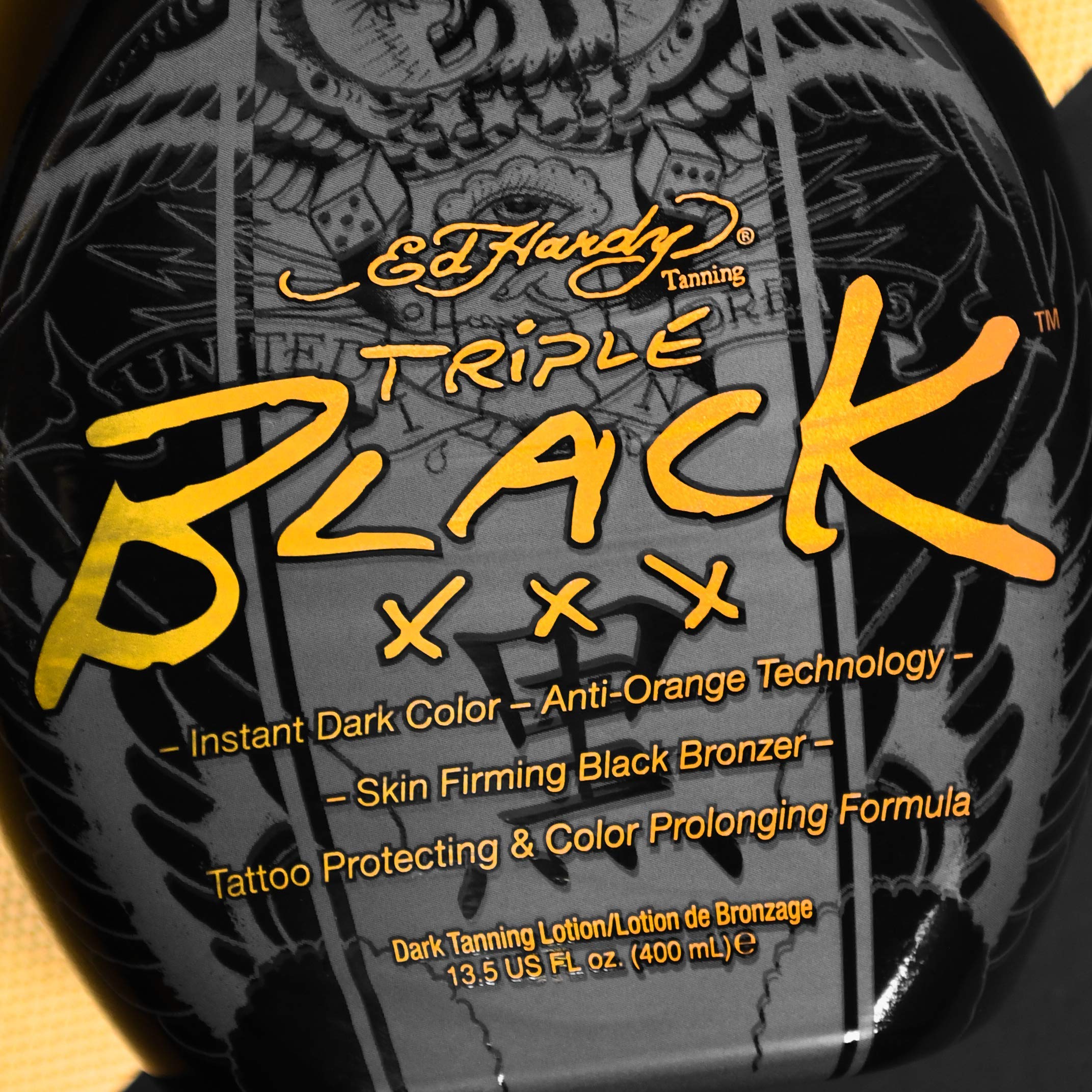 Ed Hardy Black Triple X tanning lotion packaging with tattoo protection label