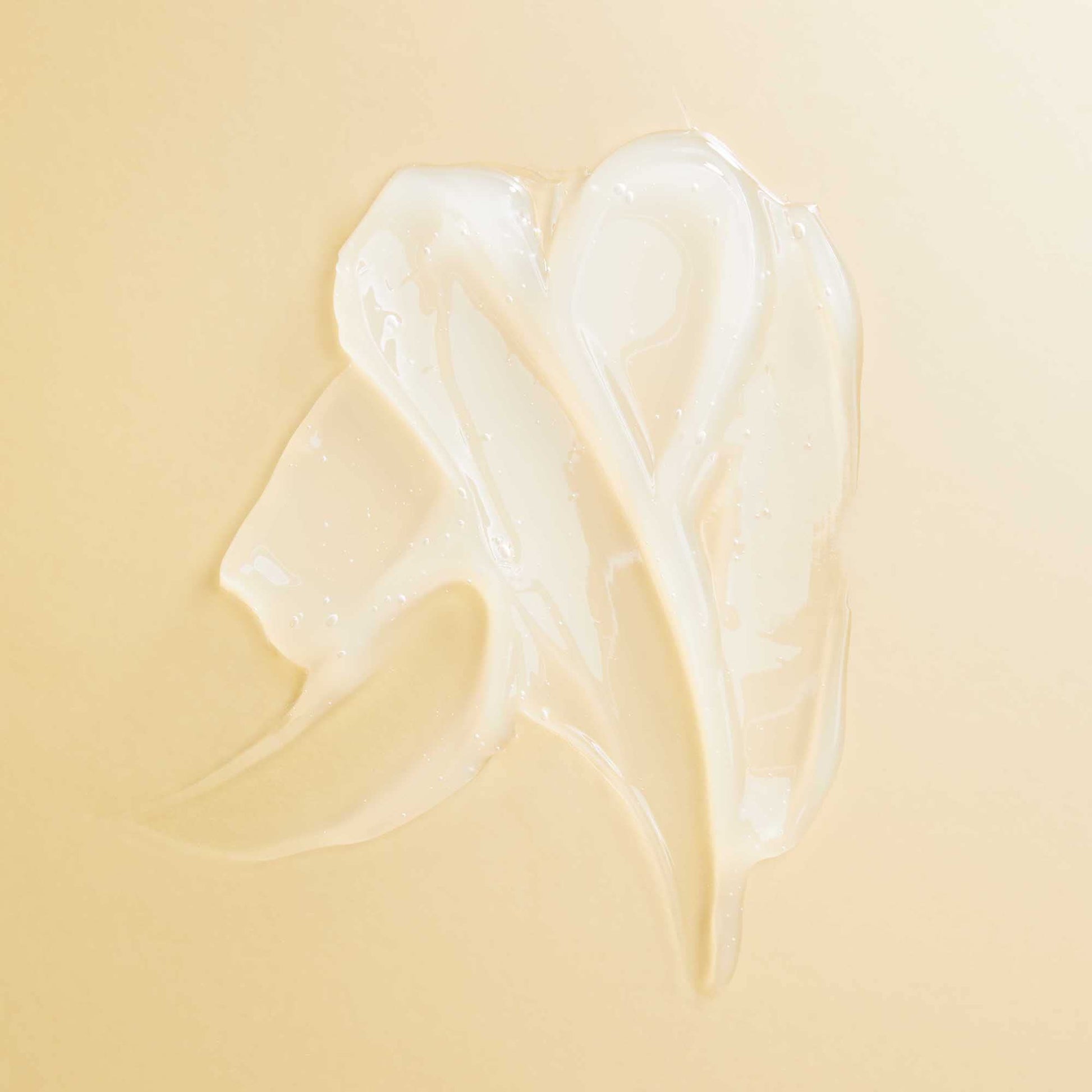 Texture shot of the rich white cream formula of PATTERN deep conditioning mask