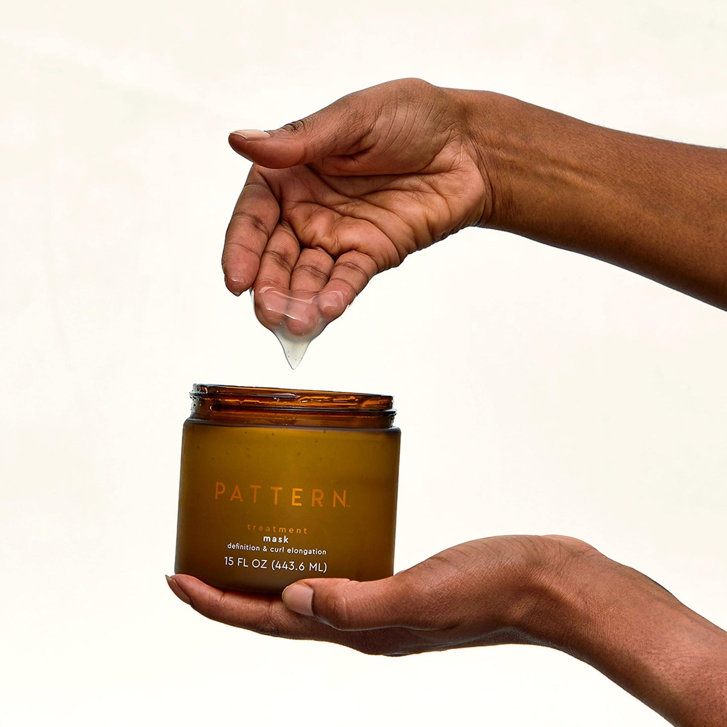 Side angle of the 15 Fluid Ounce jar of PATTERN hair mask for tight coils