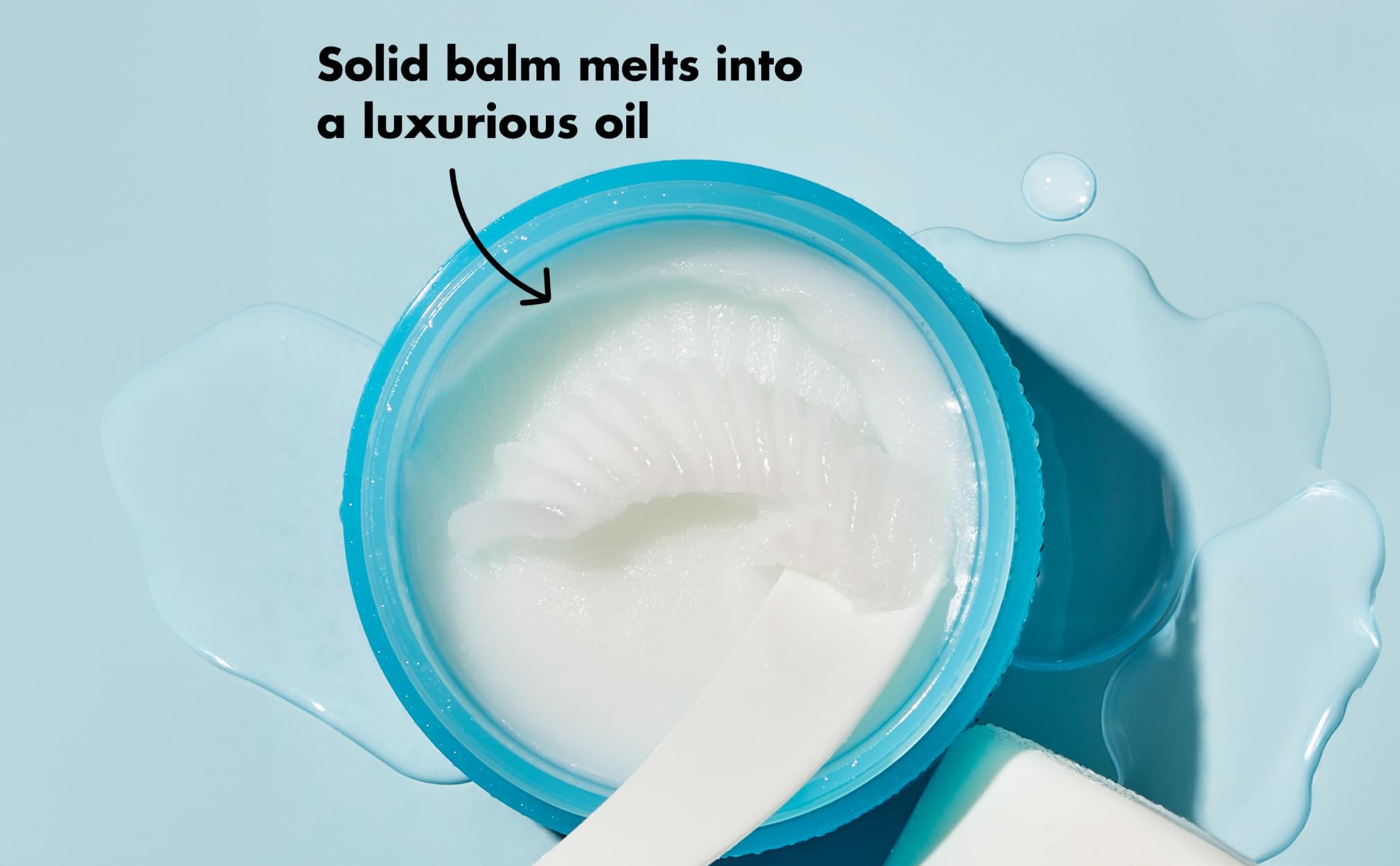 Hydrating face cleanser balm being applied to dissolve stubborn eye makeup
