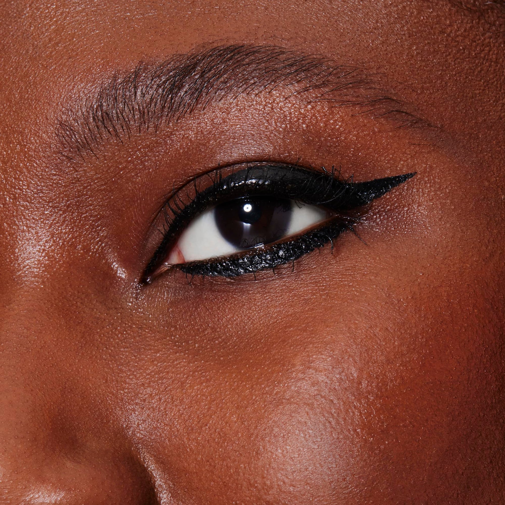 Matte finish graphic eye makeup look using e.l.f. Film Noir eyeliner