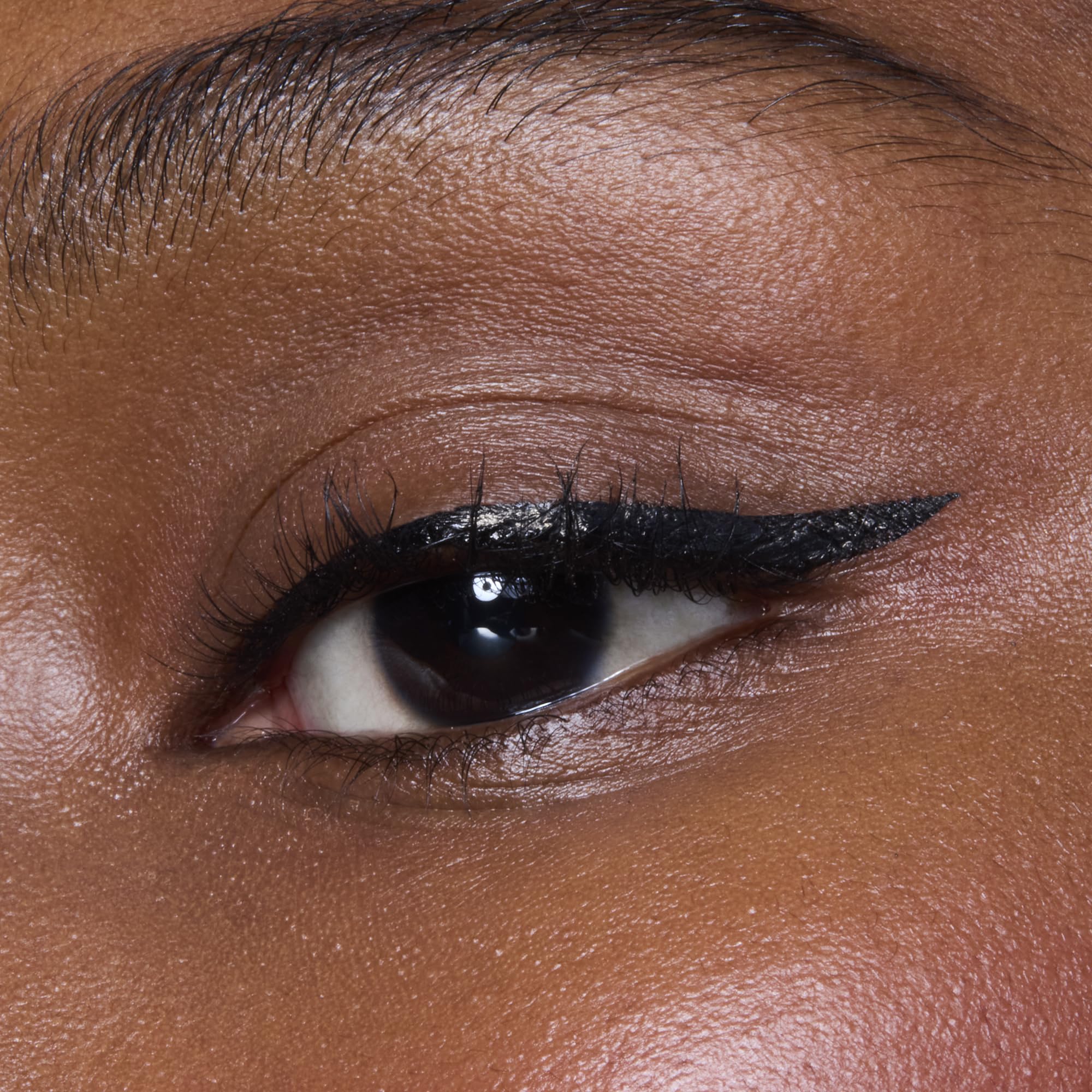 Model wearing cat eye look with e.l.f. H2O Proof Eyeliner