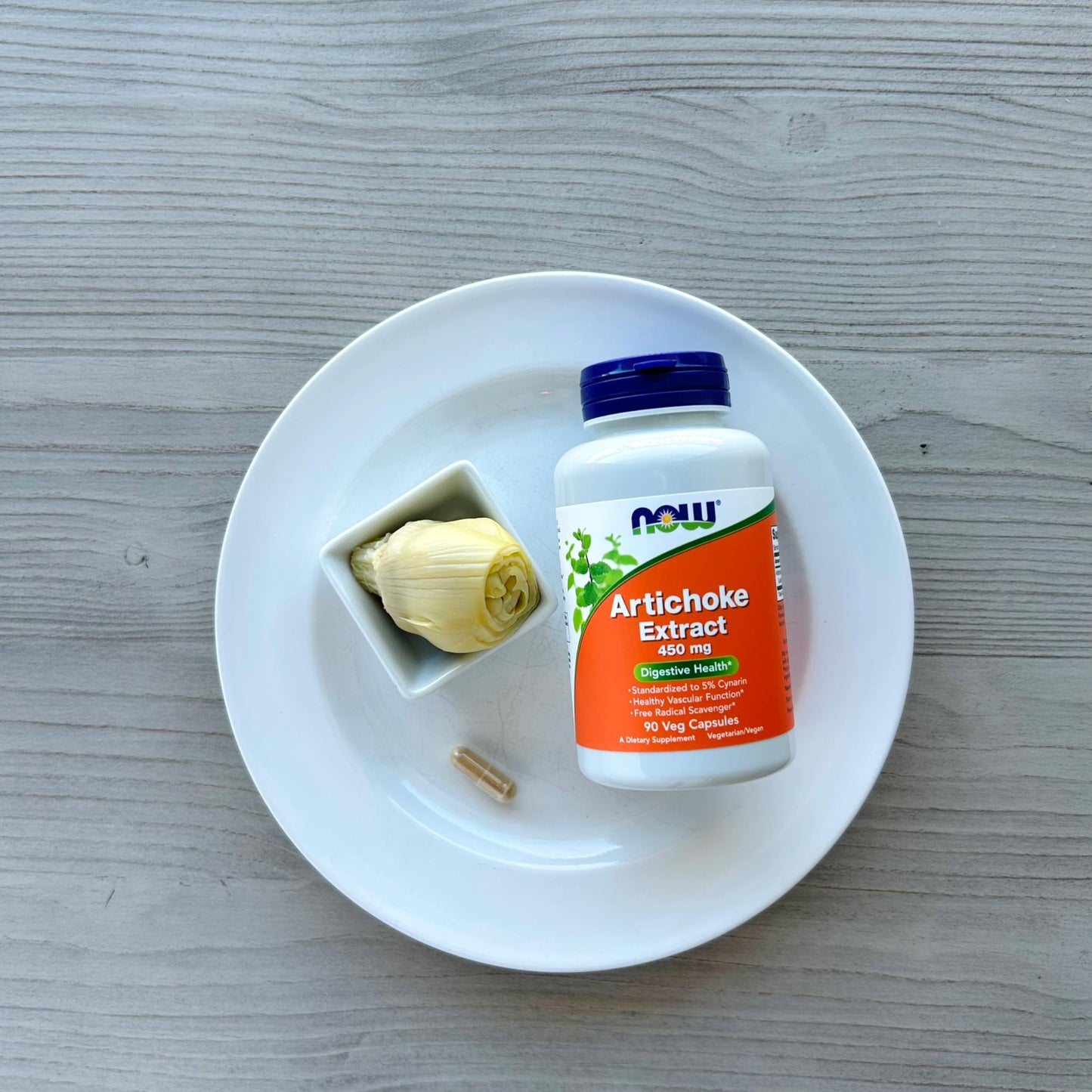 A group look at the packaging of NOW Foods herbal remedies focusing on digestive wellness.