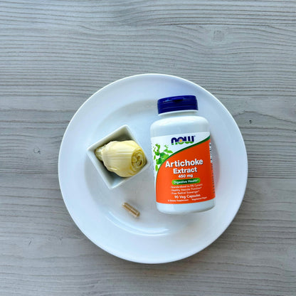 A group look at the packaging of NOW Foods herbal remedies focusing on digestive wellness.