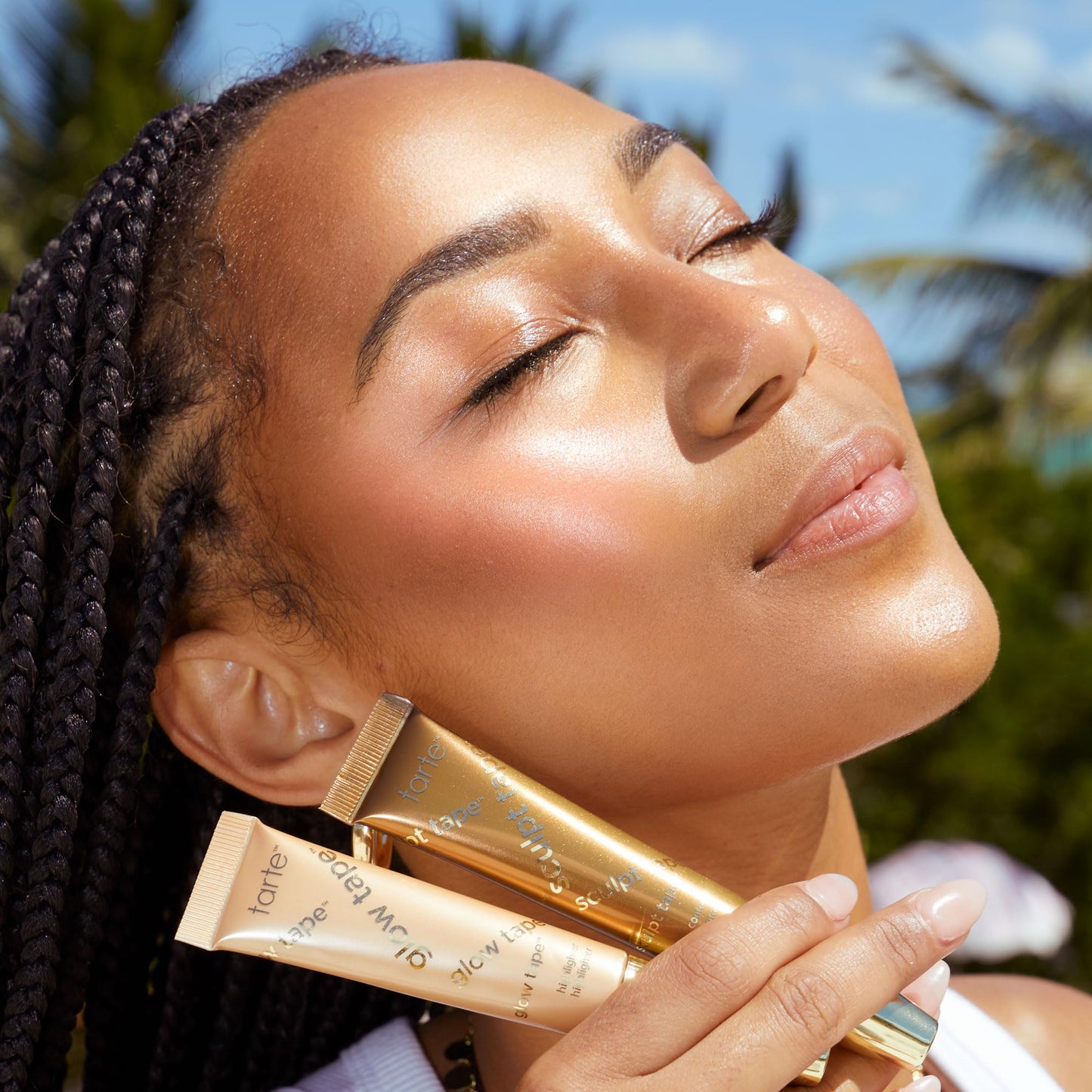 Tarte Glow Tape vegan highlighter on beauty vanity setup