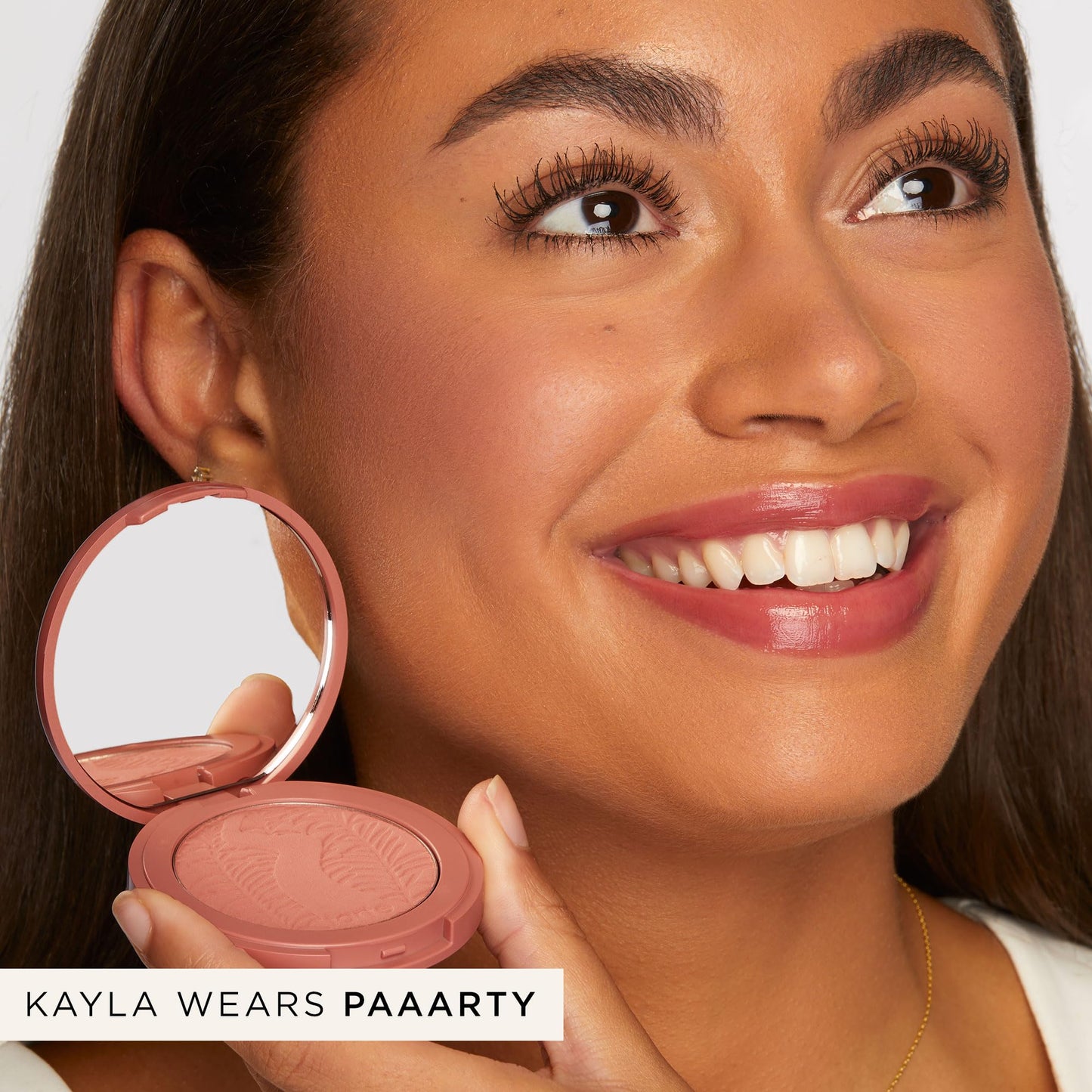 Tarte Paaarty blush texture close up highlighting the silky matte powder formula.