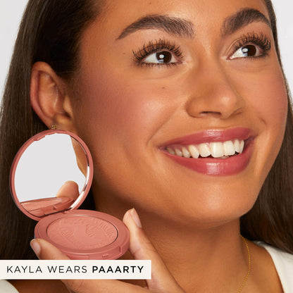 Tarte Paaarty blush texture close up highlighting the silky matte powder formula.