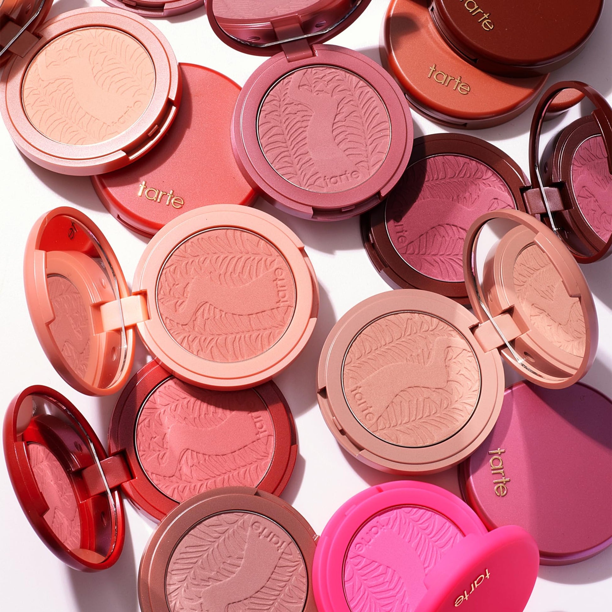Tarte dusty rose cheek color container resting open to display the fine mineral pigments.