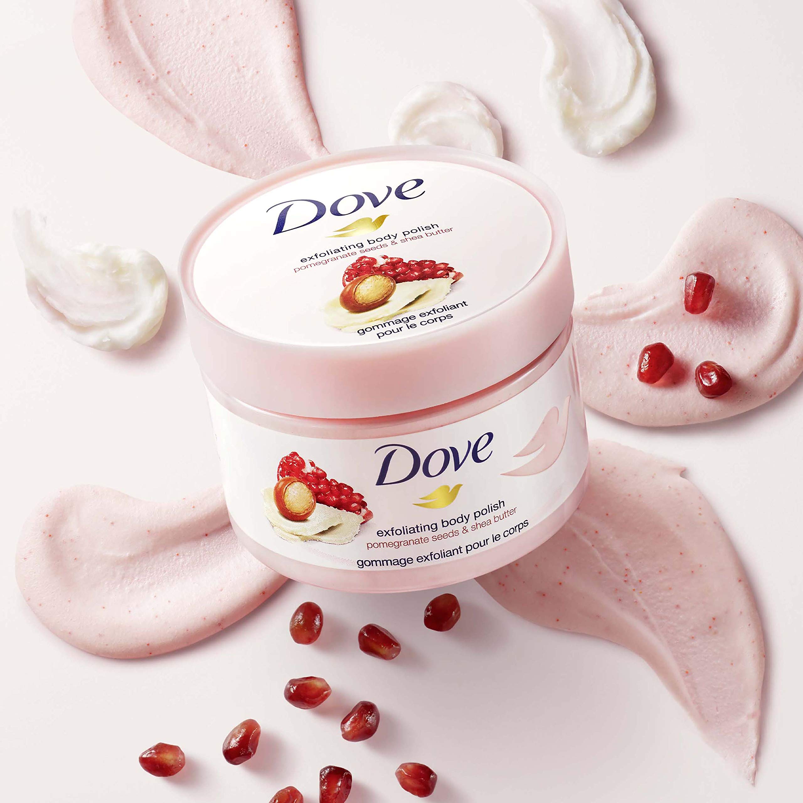 Authentic USA imported Dove body polish jar placed next to fresh pomegranate fruits
