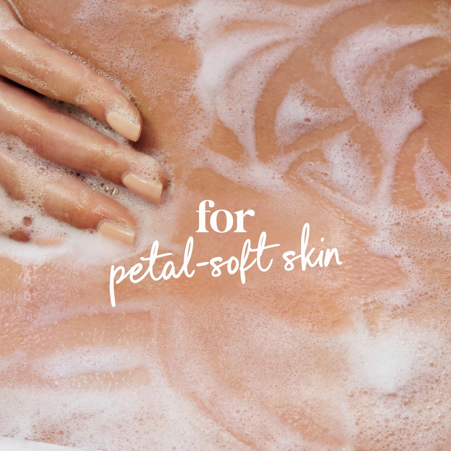 Texture shot of the light gel formula of Dove Peony body wash on a clear surface showing its creamy consistency.