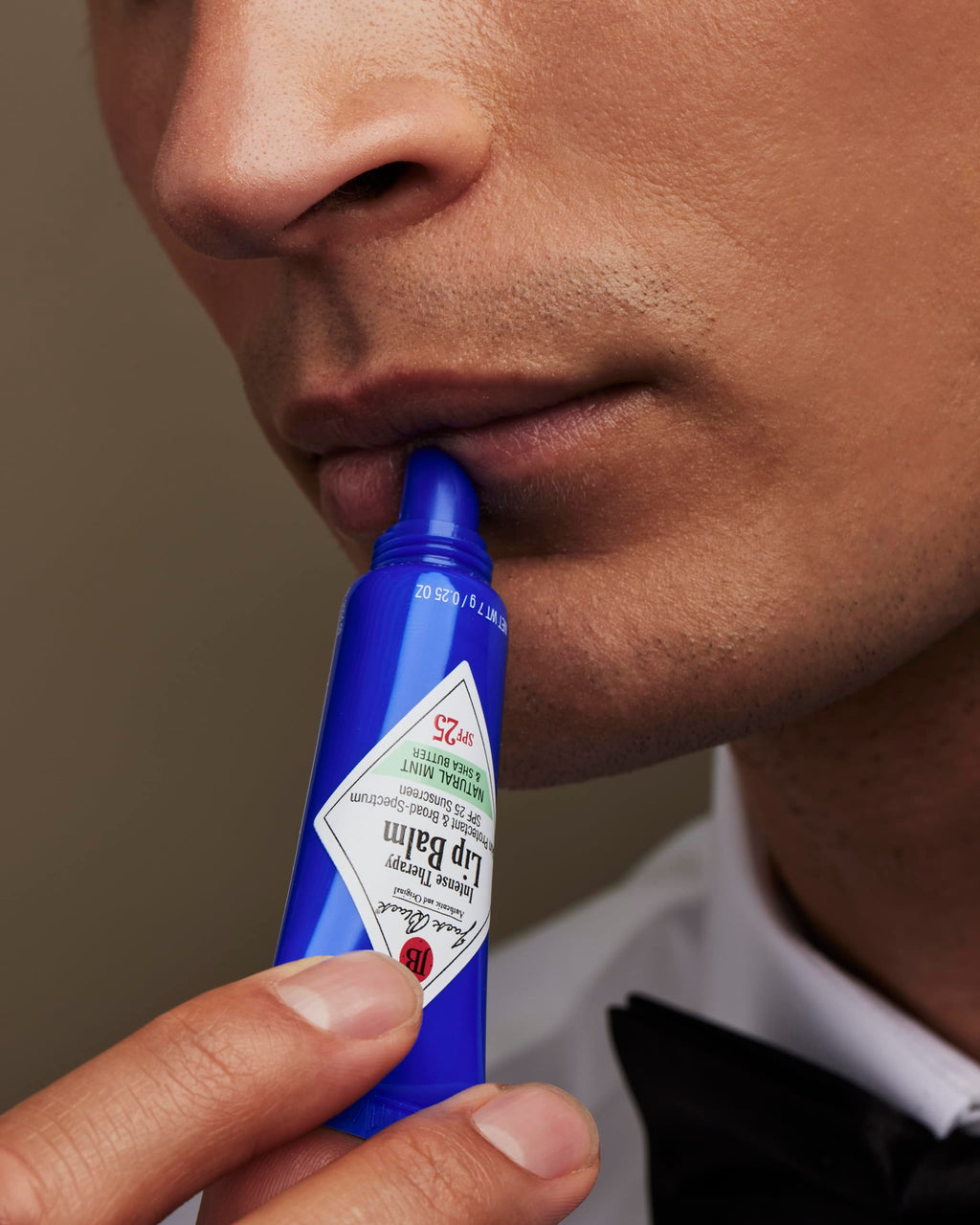 Side profile of Jack Black SPF 25 lip balm tube