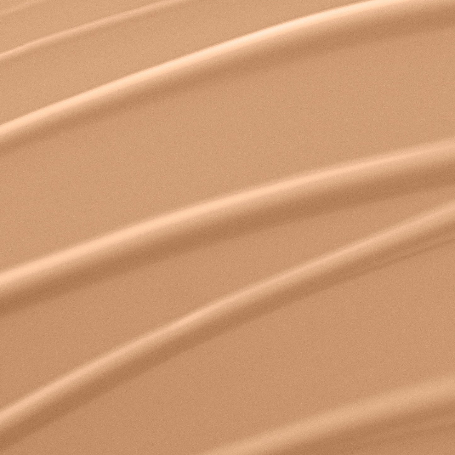 Lancome liquid foundation bottle showing the clear product shade and white cap closure