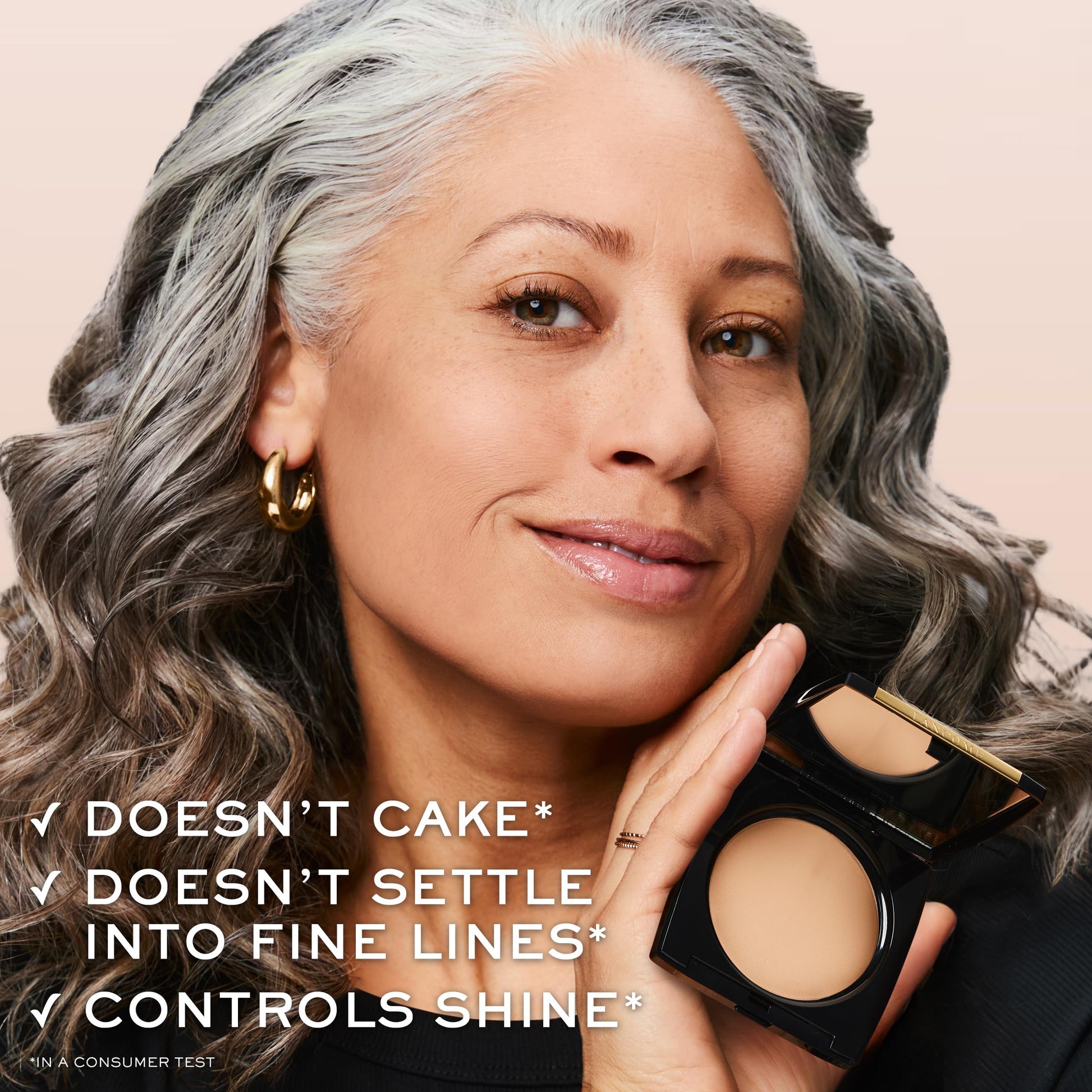 Lancôme Dual Finish longwear face powder angled shot highlighting the luxury embossed logo.