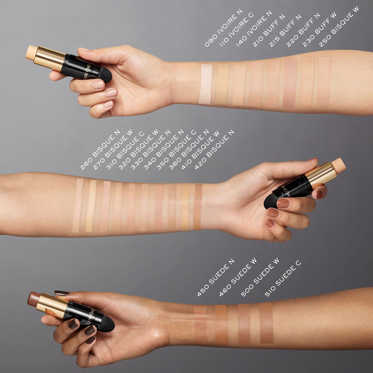 Lancome oil free foundation stick being applied to swatches of different skin tones.