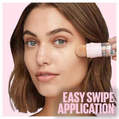 Close-up of the built-in sponge applicator on the Instant Age Rewind Glow liquid makeup bottle.