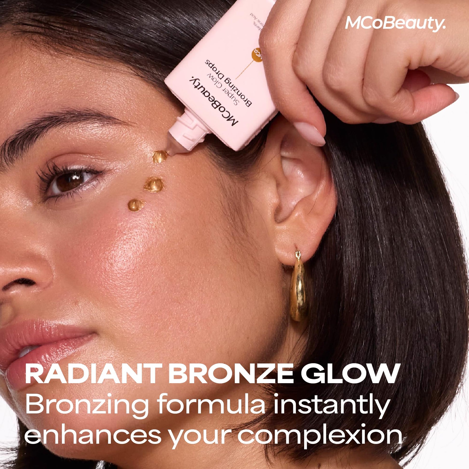 MCoBeauty liquid bronzer serum drop texture on a clean background highlighting the golden shimmer.