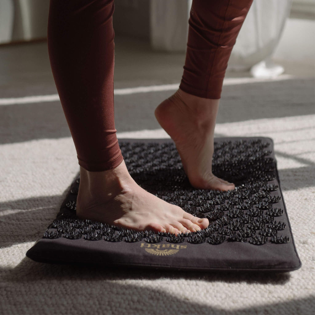 Lifestyle view of ShaktiMat set up for evening relaxation routine