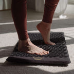 Lifestyle view of ShaktiMat set up for evening relaxation routine