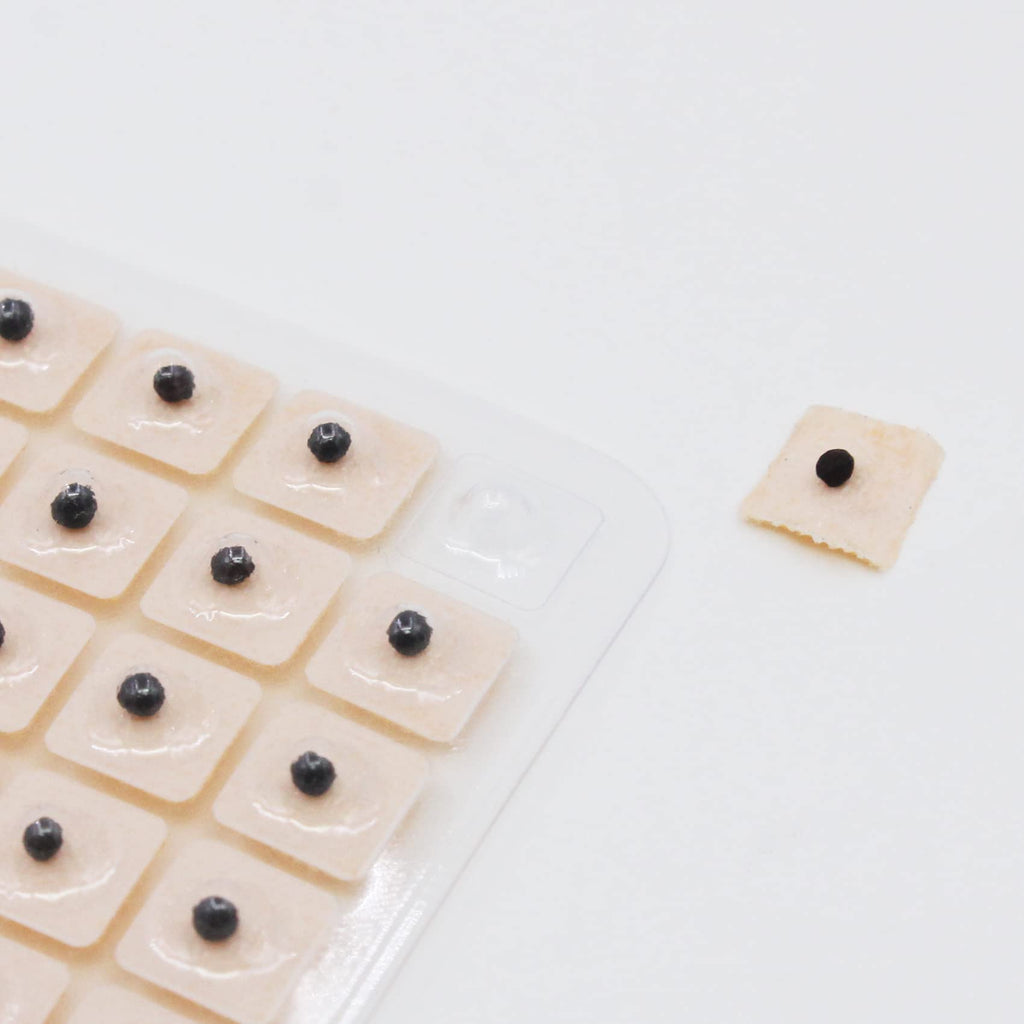 Hedigon precision tweezers and ear reflexology chart