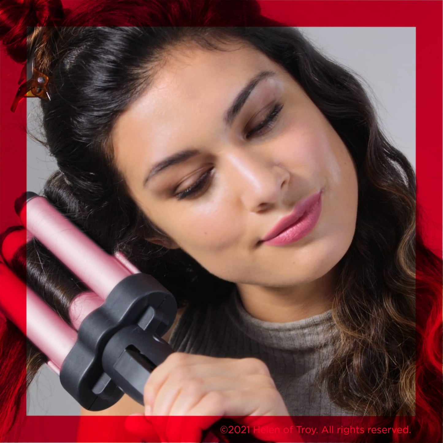 Close up of the three ceramic coated barrels on the Revlon pink hair waver tool