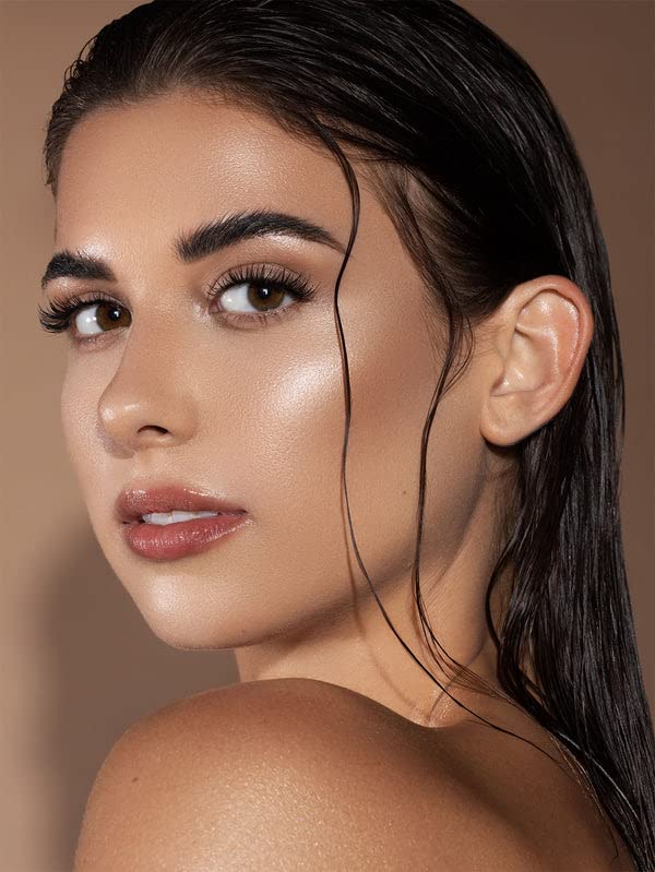 SHEGLAM liquid face shimmer in Vanilla Frost shade demonstrating the attached built-in plush sponge applicator cap