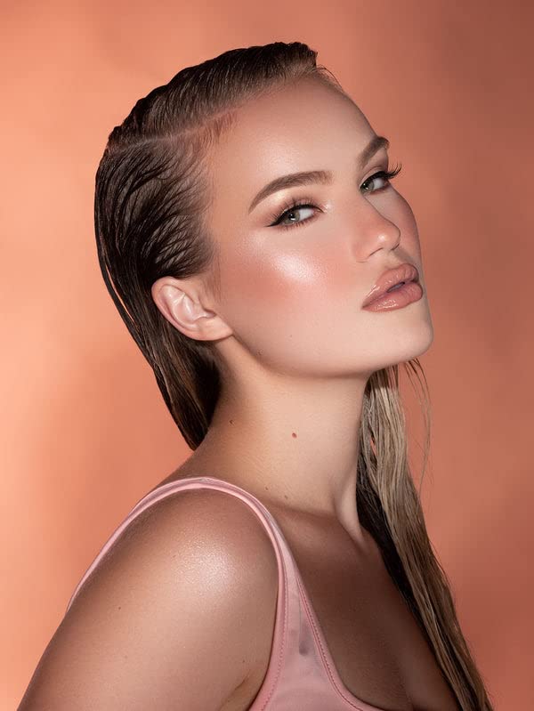 Long lasting cream highlighter swatch on skin revealing the dewy reflective finish and radiant glow