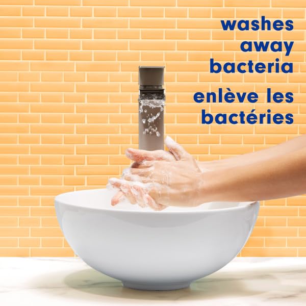 Softsoap antibacterial hand soap refill bottle placed neatly on a bathroom vanity counter.