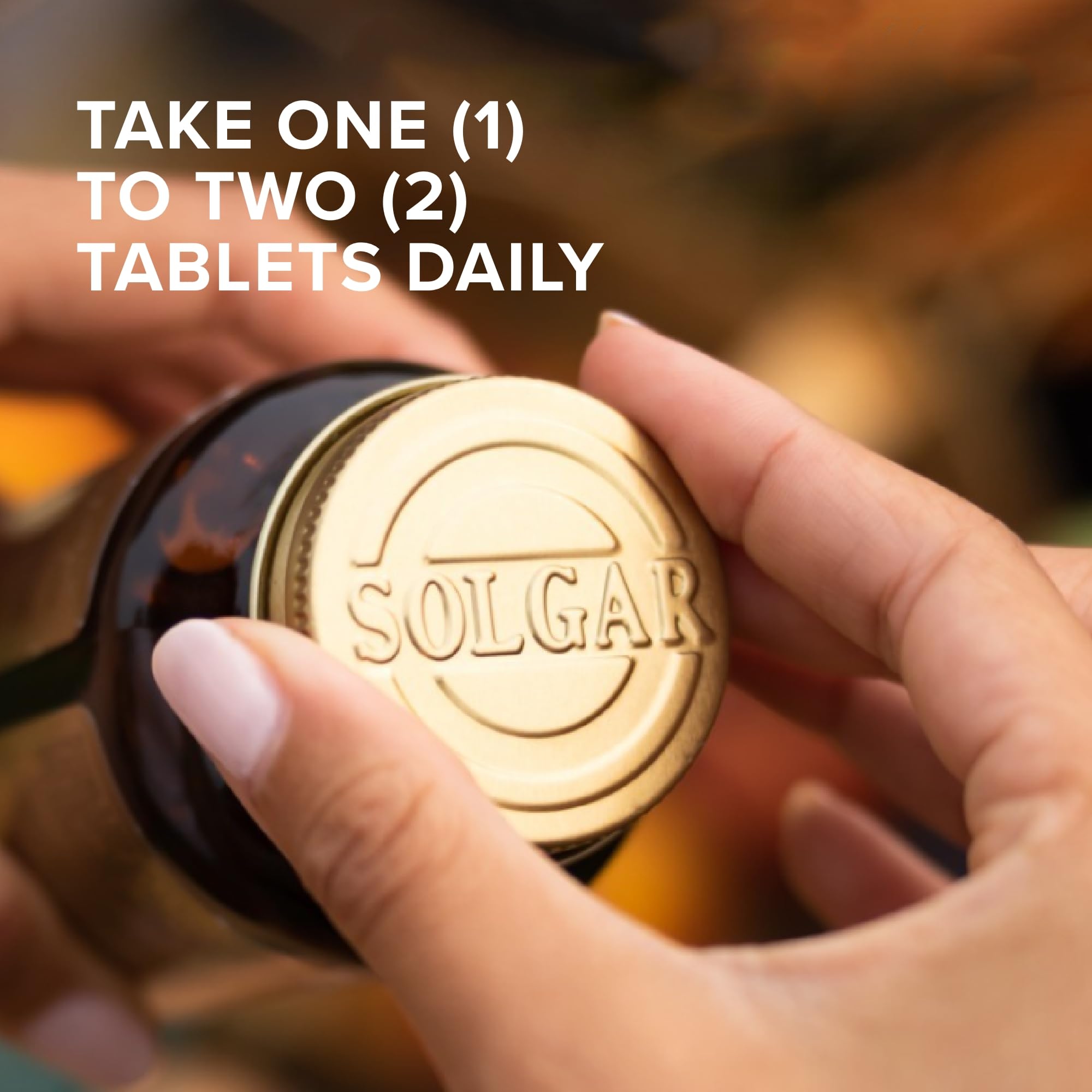 Solgar yeast-free dietary supplement tablets next to the dark glass bottle indicating premium light protection.