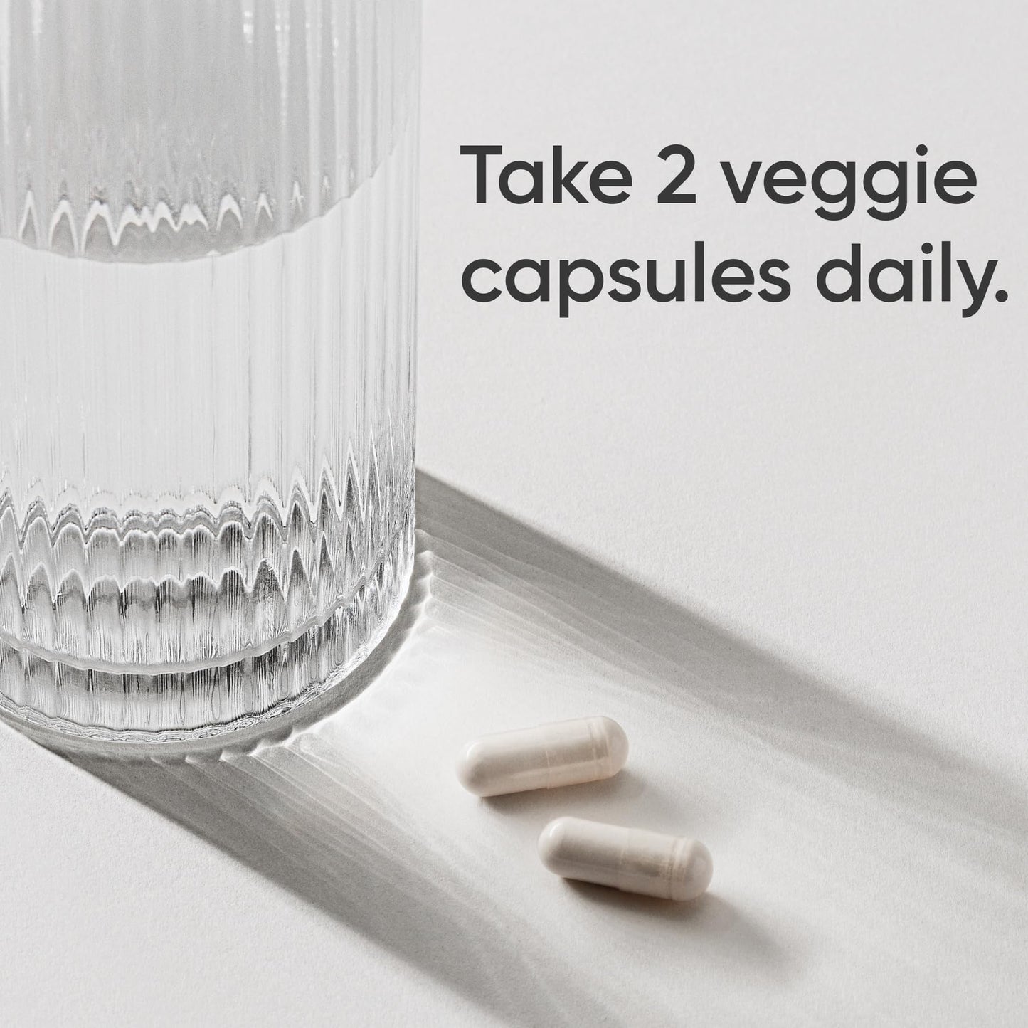 Side view of Sports Research vegan magnesium glycinate bottle showing non-GMO verified badges.