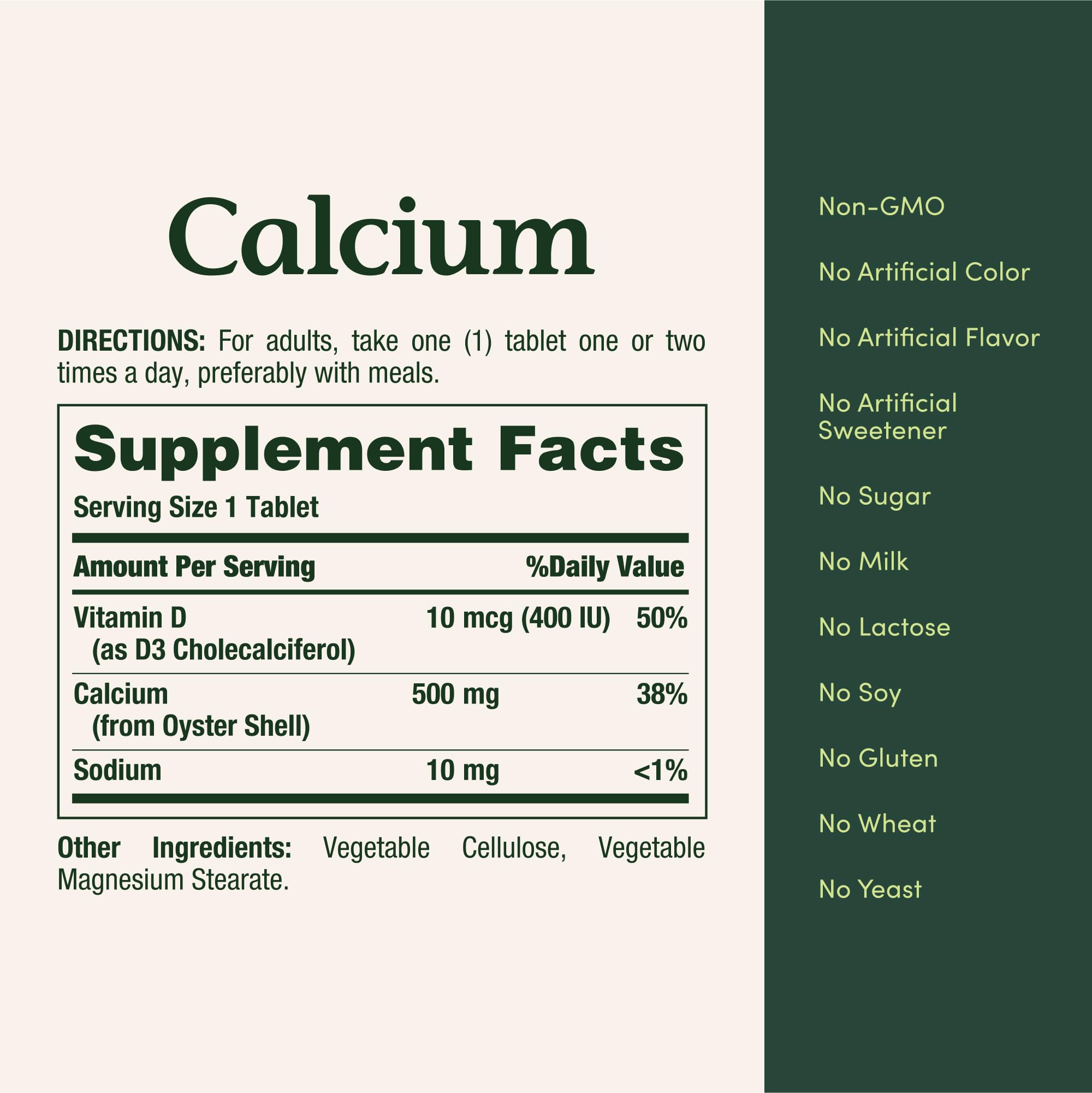 Close up of the round white Nature's Bounty Calcium 500mg tablets showcasing texture and approximate size