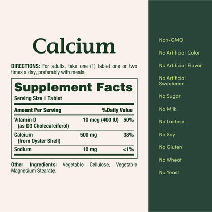 Close up of the round white Nature's Bounty Calcium 500mg tablets showcasing texture and approximate size