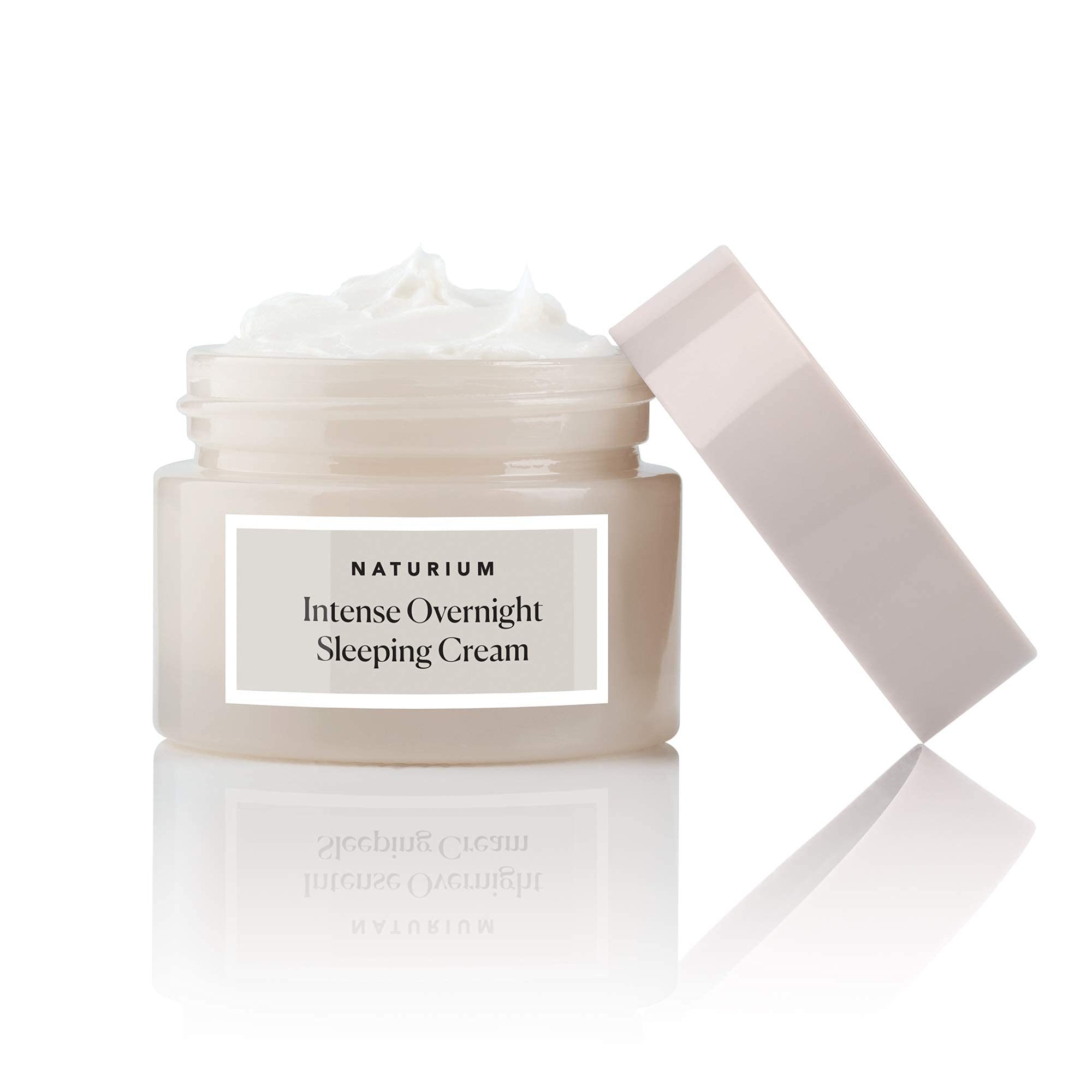 Side angle view of Naturium hydrating sleeping cream container on a clean background