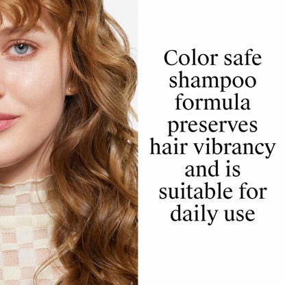 Neutrogena shampoo bottle next to pink grapefruit