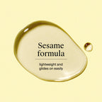 Neutrogena body oil bottle next to water drops texture