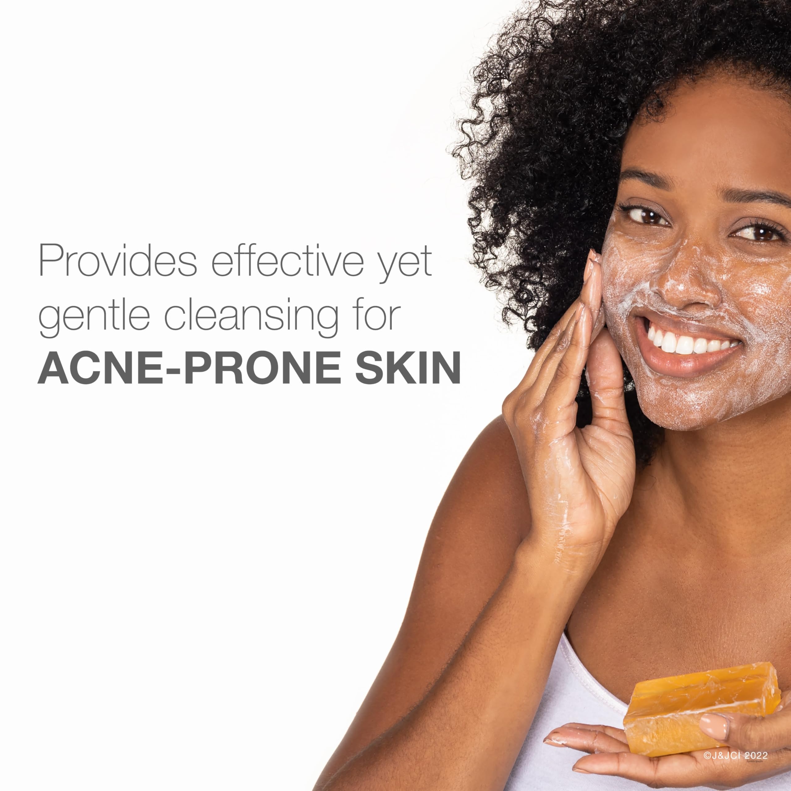 Glycerin-rich transparent facial cleansing soap by Neutrogena showing the amber bar texture.